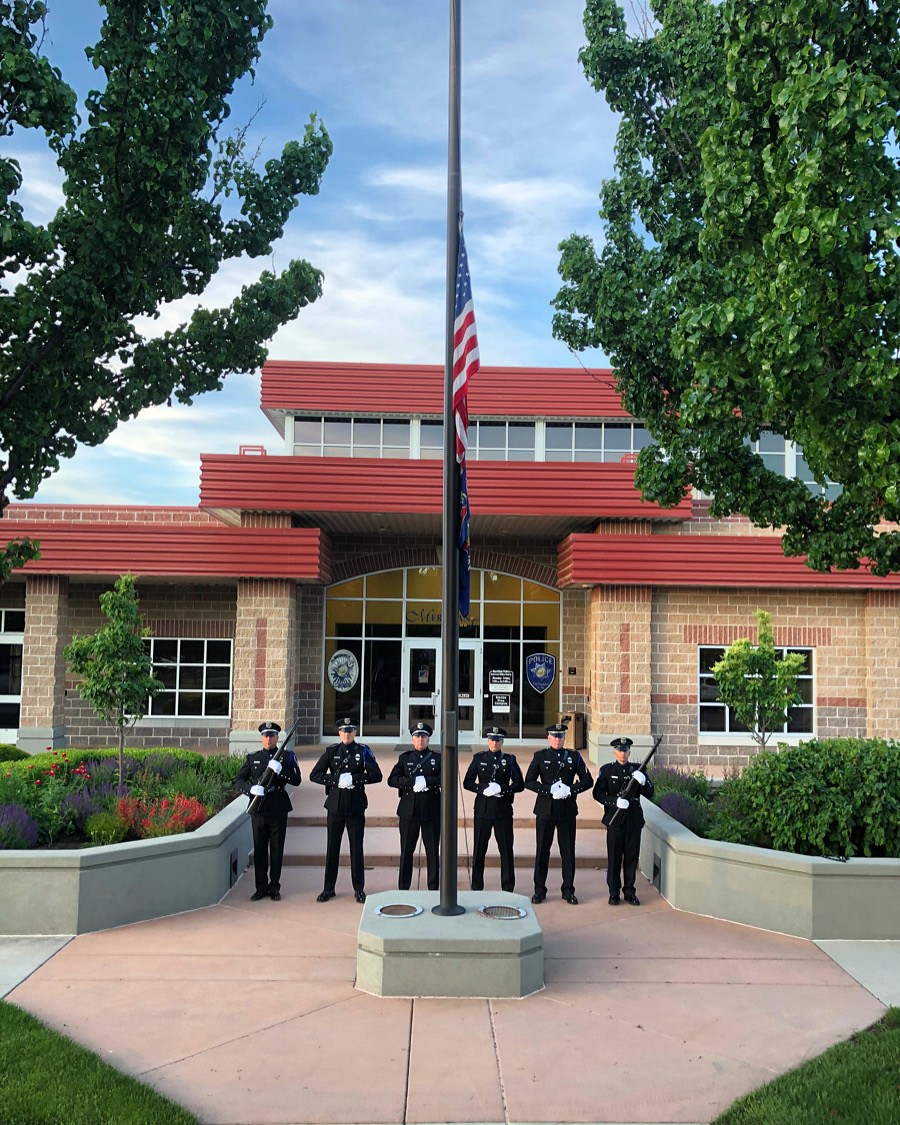 Honor Guard standing in front of the Police Department